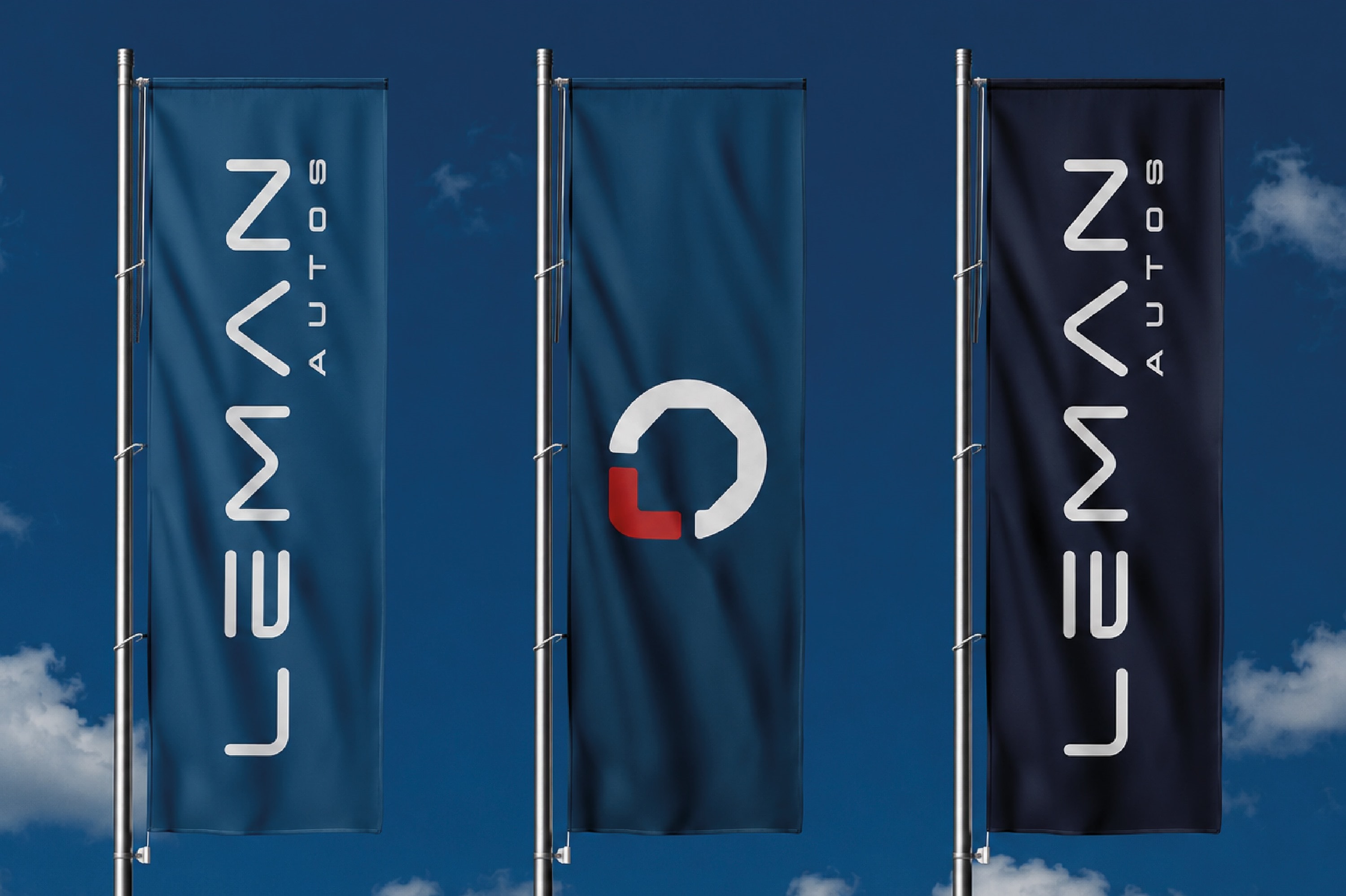Banderas verticales de Leman Autos contra el cielo